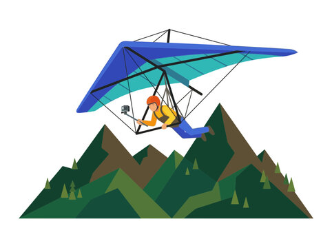 Hang glider pilot with camera flying over mountains