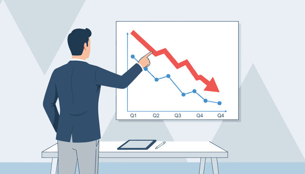 Businessman pointing at a declining financial chart on a presentation board representing economic recession or business losses.