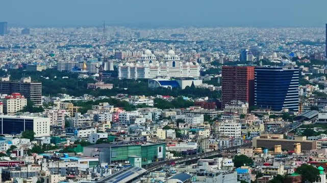 Hyderabad cityscape with Secretariat, Pranava One hsel buildings, metro line and Hyderabad Central at Punjagutta, telangana, india. day time, push back shot, drone shot, 4k.