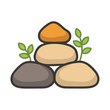 Stacked stones with green leaves