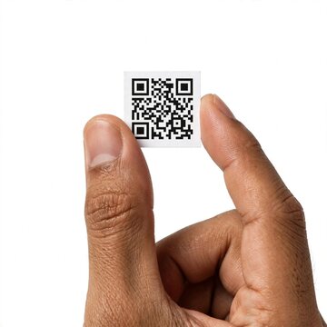 Hand holding white QR code card on white background faceless cropped