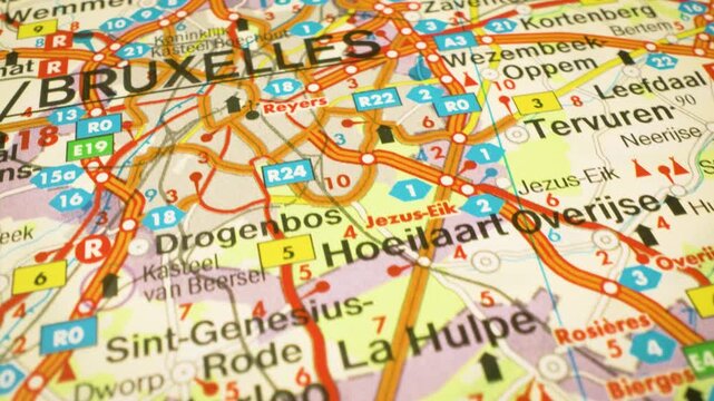 road network leading to bruxelles belgium gliding over atlas map