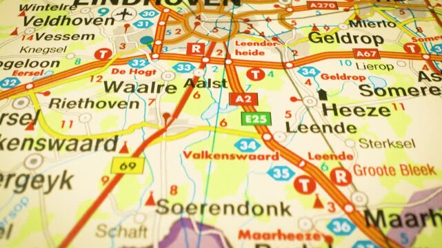 road network leading to eindhoven, netherlands, gliding over atlas map