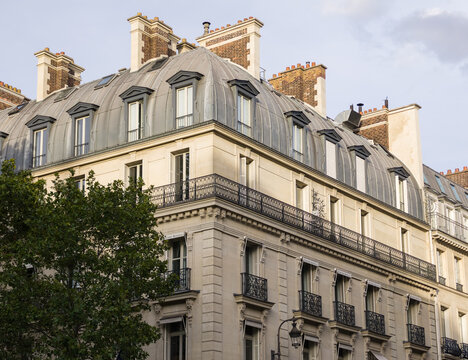 Paris Haussmann architecture with mansard roof and dormer windows