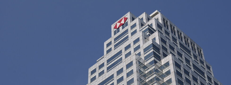 The U Chu Liang building with the prominent HSBC logo soars into a clear blue sky in Thai capital Bangkok