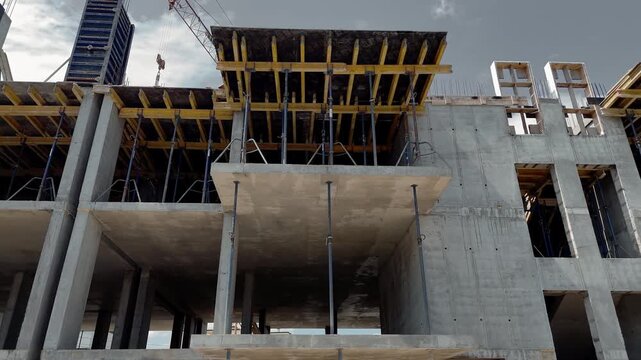 Low angle view of concrete walls and timber formwork on a building site, Infrastructure project demonstrates planning and property investment