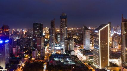 Fototapeta premium Night View of Modern Urban Skyscrapers and Cityscape