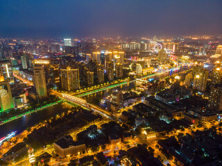 Fototapeta premium Night View of a Modern Urban City with River and Bridges