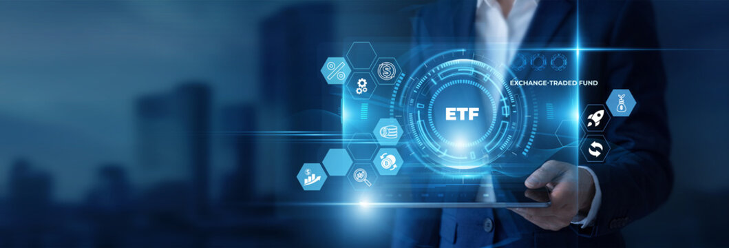 Businessman Hand Holding Digital Tablet to Analyze ETF Data and Exchange Traded Fund, Asset Allocation, Portfolio Management, Stock Market Investment, Capital Return, Index Tracking