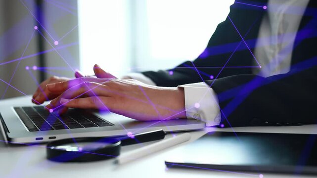 A person is typing on a laptop with hands shown in close-up. The background features digital connections that suggest technology. This occurs in an office during daytime.