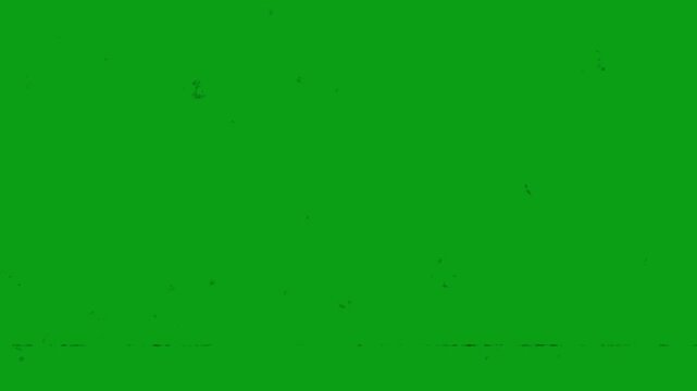 Old film tape defect and dust on green screen vintage grain scratch overlay ideal for retro video editing, chroma key, and cinematic effects.