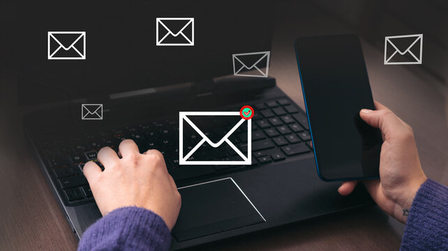 Multiple email notifications arriving on laptop and smartphone during digital communication workflow