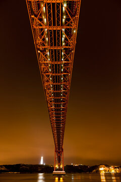 Europe, Portugal, Lisbon, View of suspension bridge with river Tagus at night