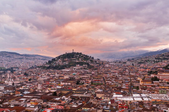 Ecuador, Quito, cityscape with El Panecillo at sunset