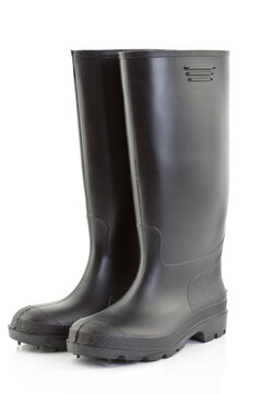 Black rubber boots on white background