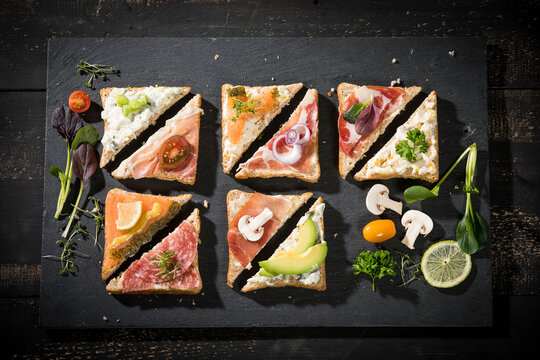 Various garnished sandwiches