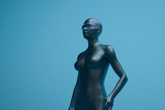 A metallic humanoid cyborg wears virtual reality glasses on blue