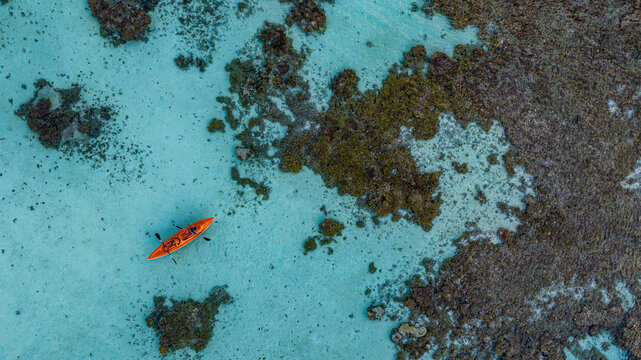 Aerial view of kayak in turquoise lagoon Fakarava French Polynesia