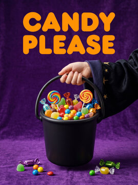 Halloween candy bucket, colorful trick or treat sweets with hand reaching into a black bucket on purple background