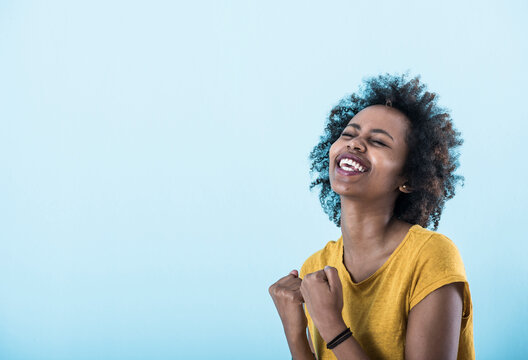 Portrait of excited young woman