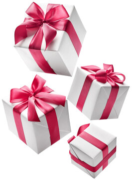 Set of white color gift boxes with red ribbon isolated