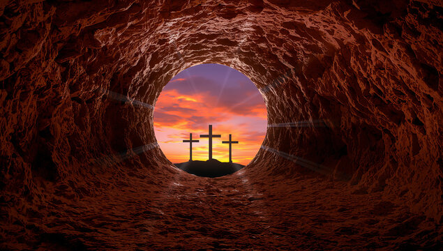 View from inside a tomb looking out at three crosses against a dramatic sunset sky
