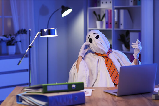 Burnout and work stress, ghost character working late on laptop in a dark office with deadline pressure