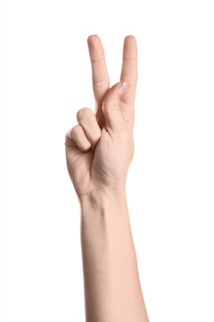 Victory and peace sign hand gesture showing number two or success communication and body language concept isolated on a clean white background