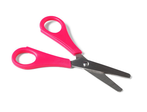 Creativity and education, pink safety scissors for children with blunt tips for arts and crafts projects isolated on a clean white background