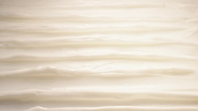 Smooth White Skincare Face Cream Lotion Texture Macro Close Up Wavy Ridges Pattern Light Moving Abstract Background Beauty Cosmetic Video