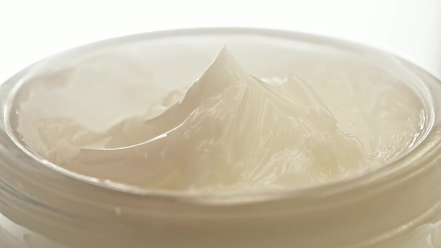 Luxury White Skincare Face Cream Thick Moisturizer Jar Glossy Smooth Texture Peak Macro Close Up Clean Background Beauty Cosmetic Commercial Video