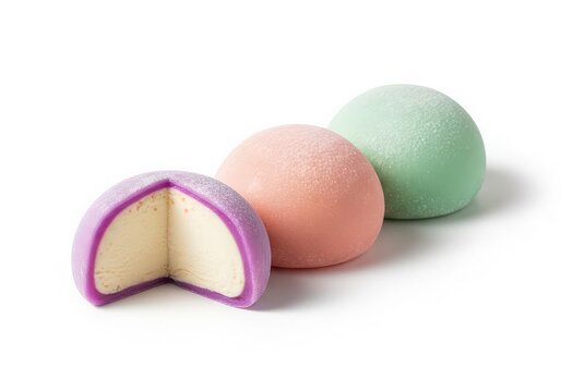 Three pastel-colored sponge cake halves with purple filling isolated on white background