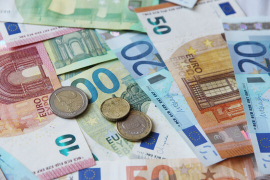 cash money euro and cents banknotes background, representing money, wealth, financial success, savings, investment, and economic prosperity, table full of money.