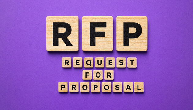 Rfp request for proposal concept spelled with wooden letter tiles on purple background
