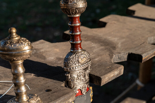 Ornate roman sword hilt resting on a wooden table The Concept of ancient craftsmanship and war