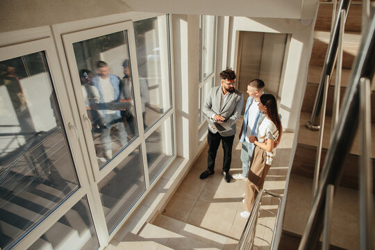 Real estate agent meeting young couple about property