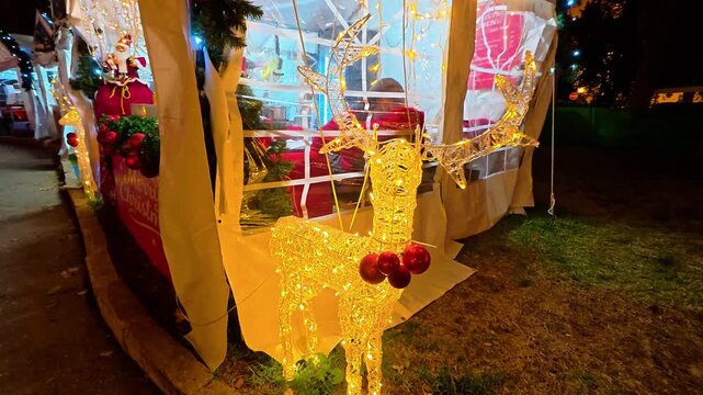 Luminous reindeer decoration at Jerusalem christmas market at night