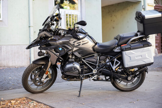 BMW R 1250 GS adventure motorcycle with luggage cases parked on a street