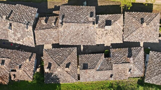 Top down aerial view stone tile roofs traditional houses Etar Ethnographic Open Air Museum authentic bulgarian architecture Gabrovo Bulgaria culture travel history drone