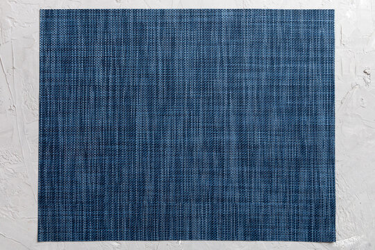 Top view of grey tablecloth for food on cement background. Empty space for your design