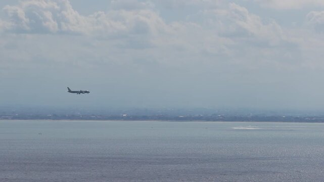 Airplane Approaching For Landing Over The Sea Near I Gusti Ngurah Rai International Airport In Bali, Indonesia. - tracking shot
