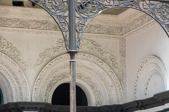 Ornate ironwork and carved plaster arches at a temple near Teota Zamindar Bari, Dhaka Division, Shivalaya, Bangladesh