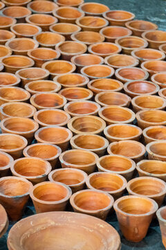 Rows of empty clay cups used for making traditional yogurt, Rajshahi Division, Bogura, Bangladesh