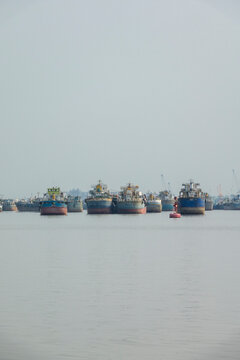 Cargo ships anchored on the river near Mongla port, Khulna Division, Bagerhat, Bangladesh