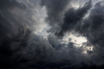 Obraz premium dramatic dark clouds in the sky, dark storm clouds in a dark sky before rain,beautiful landscape with cloudy sky 
