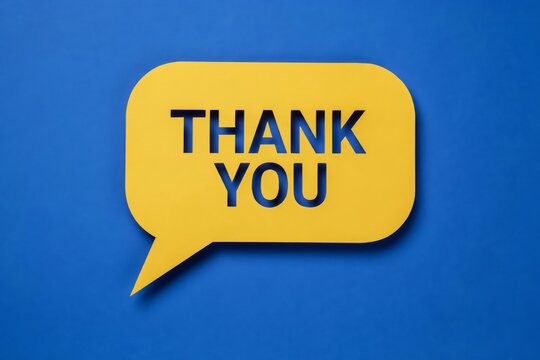 Yellow speech bubble with the words thank you cut out, placed on a vibrant blue background, representing gratitude and communication