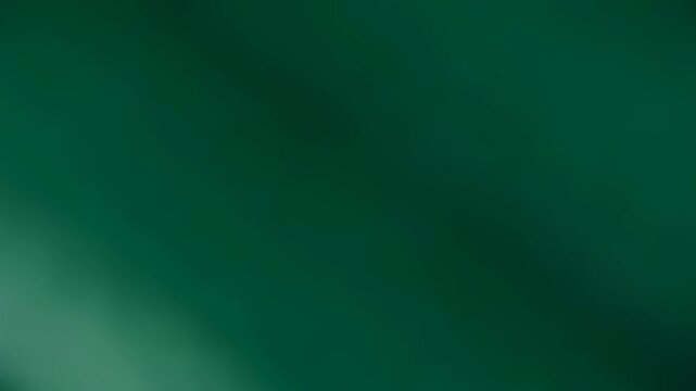 Dark green fabric flowing in waves. Abstract silk textile movement. Elegant smooth drapery texture for luxury background. Minimalist wallpaper design element.