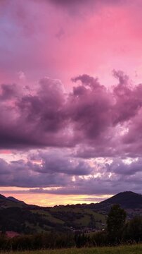 Vertical Time Lapse Of Dramatic Pink Sunset Over Rural Mountain Landscape