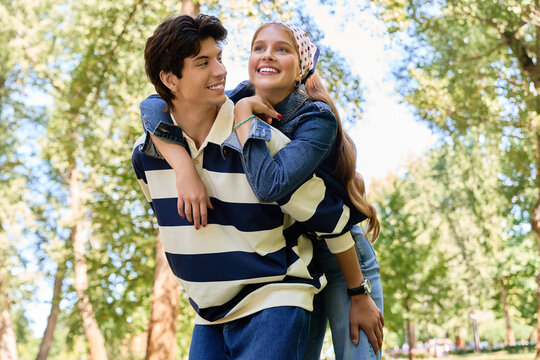 Young lovers enjoy a delightful autumn date in the city park
