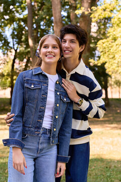 A happy young couple enjoys a delightful date together in a vibrant autumn park